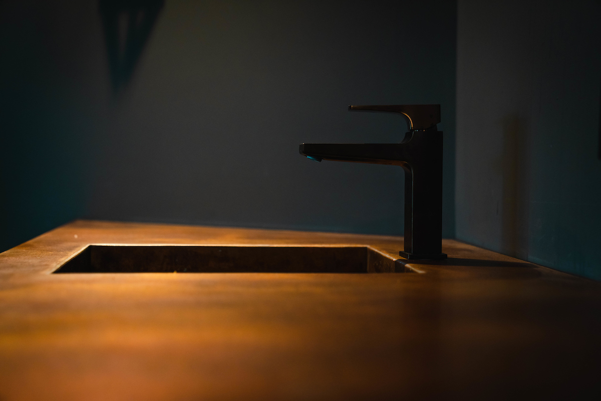 Black sink with a black tap