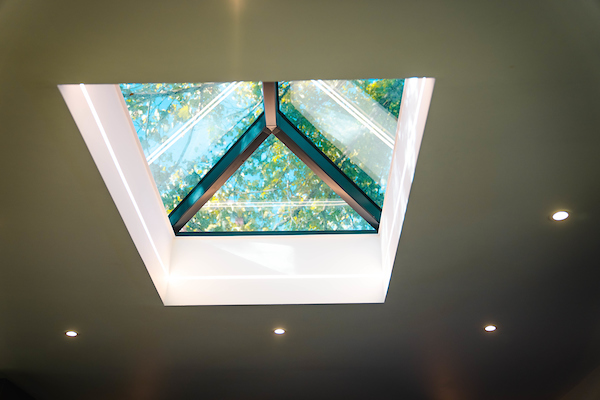 View of a skylight inside a room with white ceiling