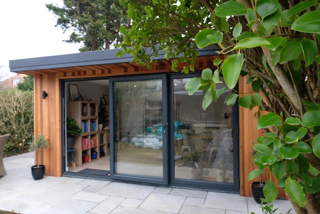 Small garden room with wooden shelving units