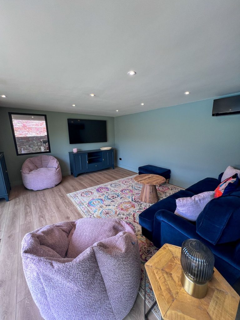 Purple beanbags in a small living room