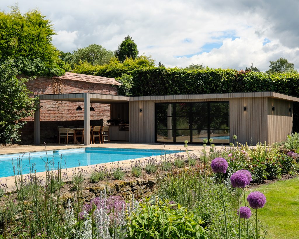 Large garden building built around a pool