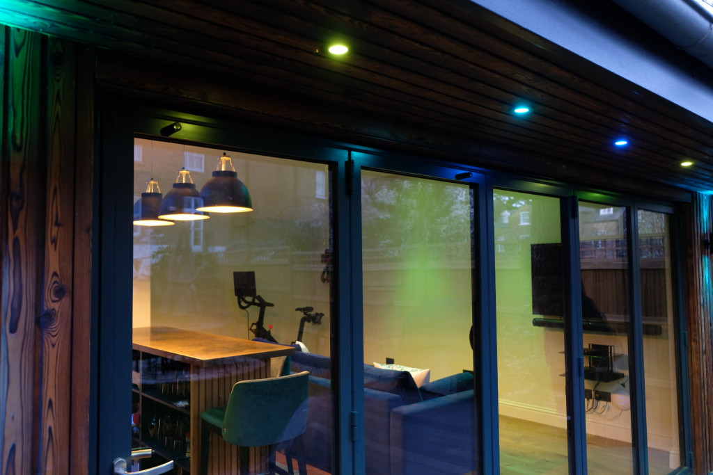 Garden games room with seating and ambient lighting