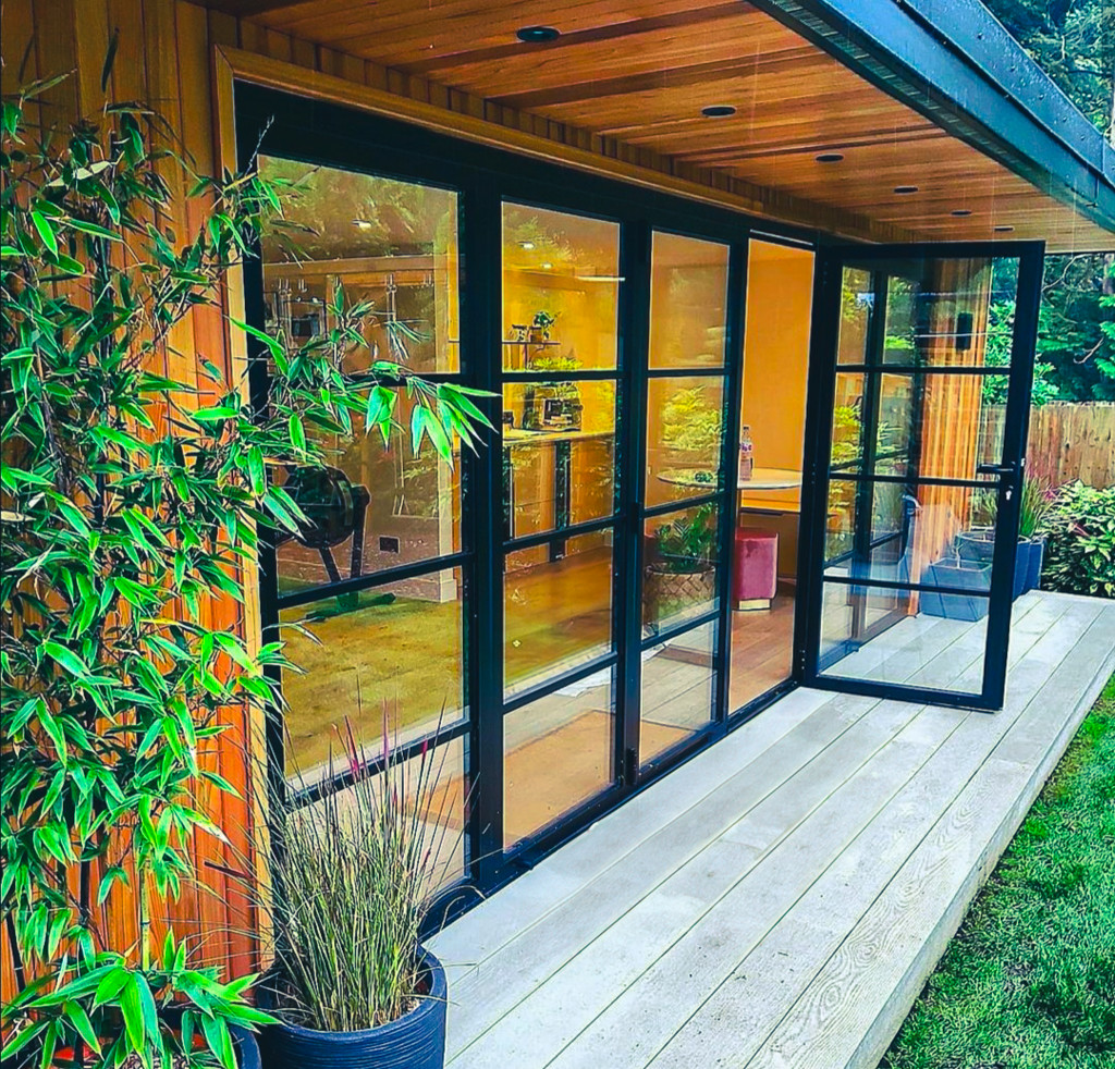 Glazed garden room exterior in a landscaped garden